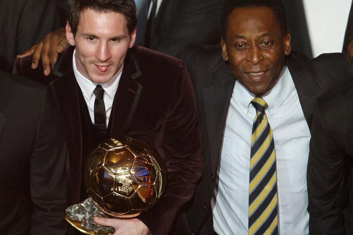 Lionel Messi of Argentina (L), FIFA World Player of the Year holds his FIFA Ballon d'Or 2011 trophy next to Pele during the FIFA Ballon d'Or 2011 soccer awards ceremony at the Kongresshaus in Zurich January 9, 2012. 