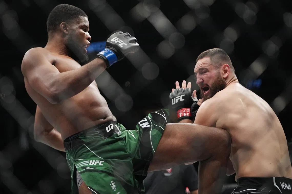 Mar 5, 2022; Las Vegas, Nevada, UNITED STATES; Nicolae Negumereanu (red gloves) fights Kennedy Nzechukwu (blue gloves) during UFC 272 at T-Mobile Arena. Mandatory Credit: Stephen R. Sylvanie-USA TODAY Sports/ File Photo