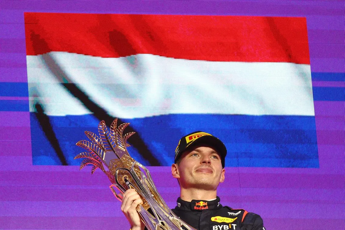 Red Bull's Max Verstappen celebrates on the podium after winning the Saudi Arabian Grand Prix.