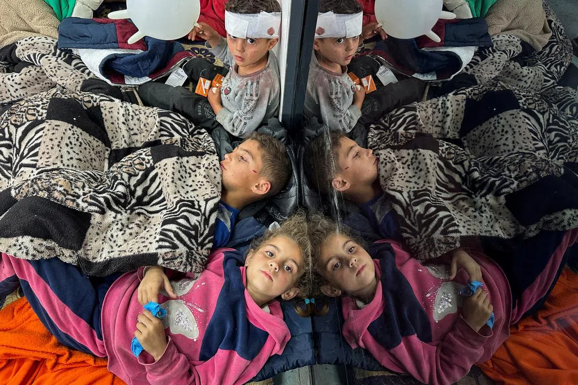 FILE PHOTO: Palestinian children wounded in an Israeli strike rest as they receive treatment at a hospital, amid the ongoing conflict between Israel and the Palestinian Islamist group Hamas, in Rafah in the southern Gaza Strip, February 12, 2024. REUTERS/Mohammed Salem/File Photo