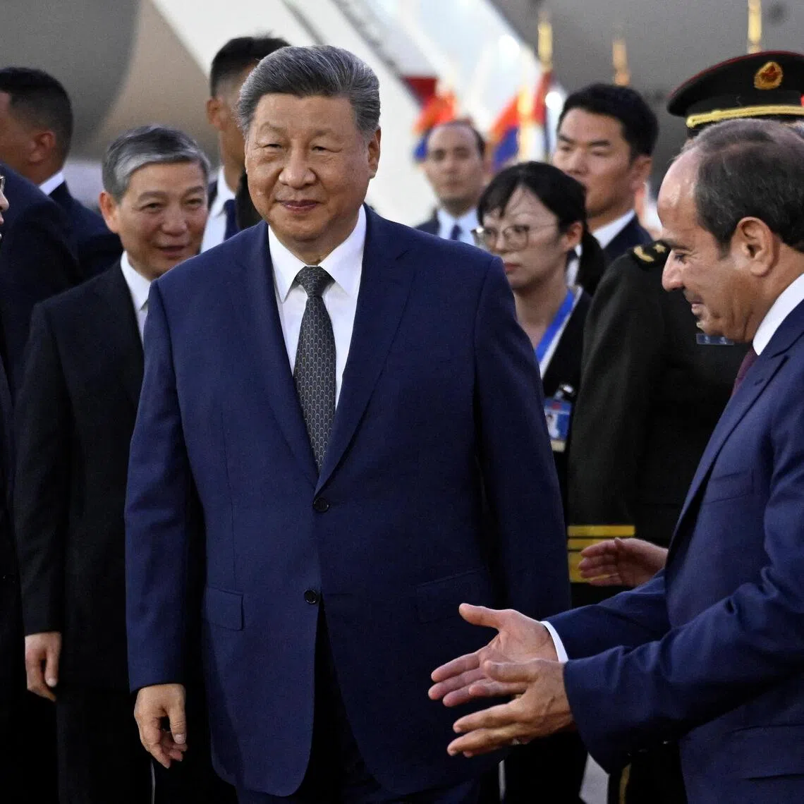 Egypt’s President Abdel Fattah al-Sisi (right) welcomes his Chinese counterpart Xi Jinping (centre) at the Cairo International Airport on Sept 1.