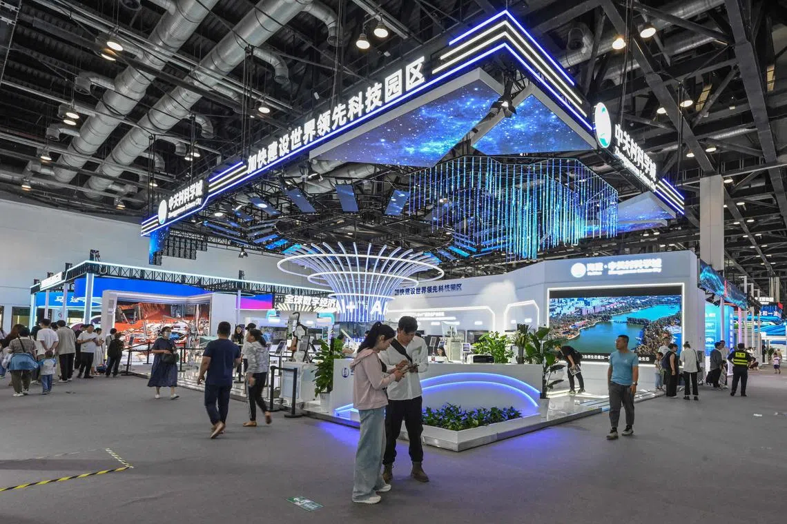 People visit the 26th China Beijing International High-Tech Exhibition at the National Convention Center in Beijing, on July 16, 2024.