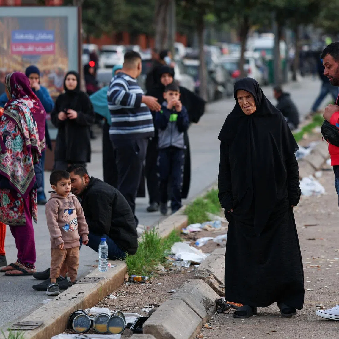 People gather after an evacuation order, following an escalation between Hezbollah and Israel, amid the U.S.-Israeli conflict with Iran, in central Beirut, Lebanon, March 12, 2026. REUTERS/Claudia Greco