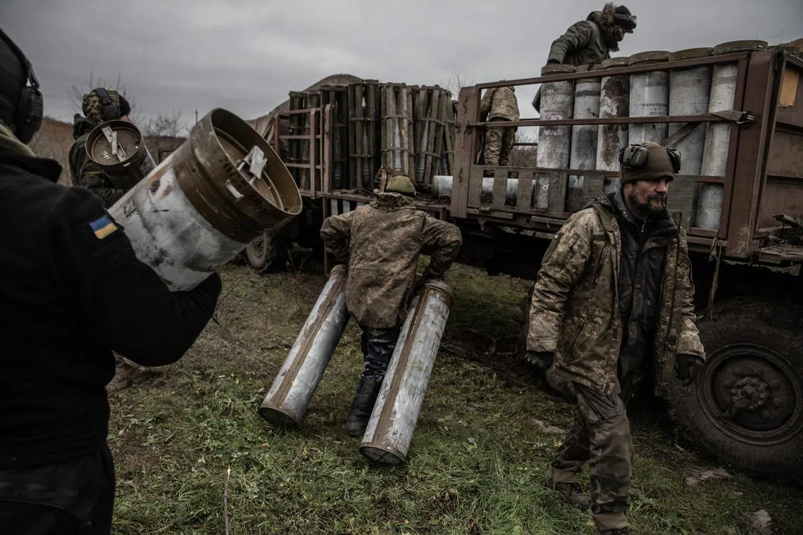 Members of a Ukrainian artillery team prepare to fire on a Russian ammunition depot across the Dnieper River, in Ukraine’s southern Kherson region.