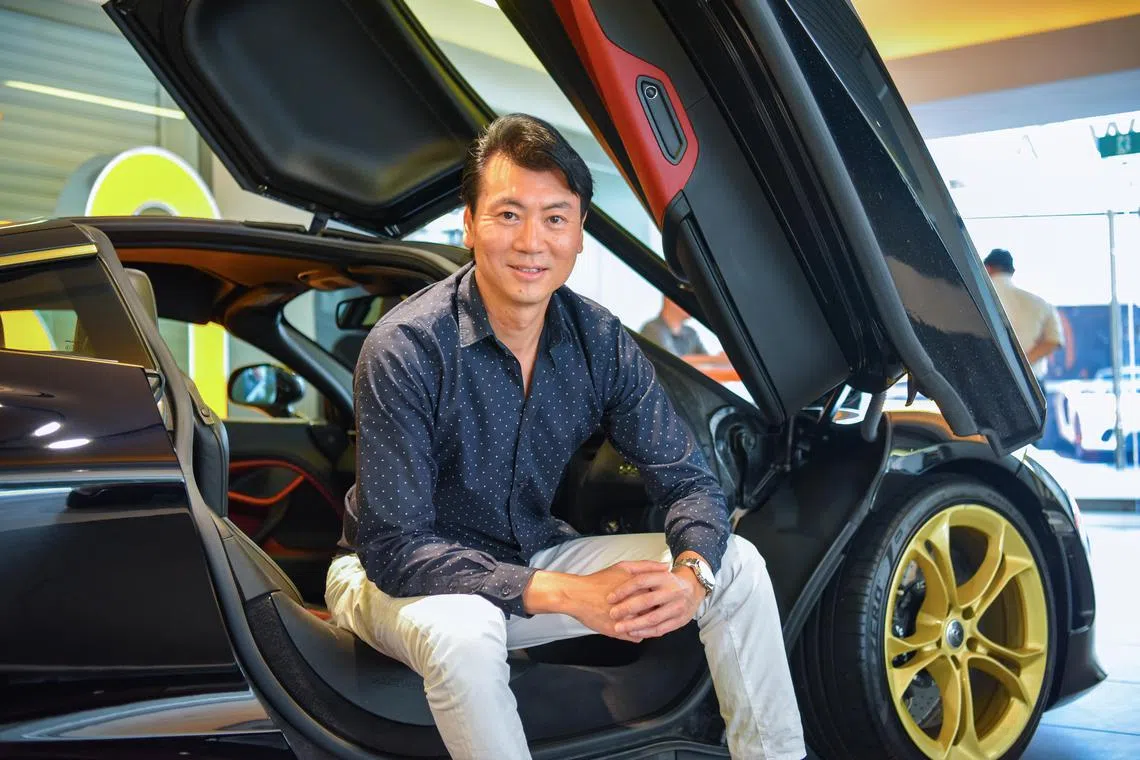 ST20230525_202364435339-Eugene Tan-Rosalind Ang-ramoney/

Founder of G8 Energy, Gerald Tan, 47, with his McLaren 720S at the McLaren showroom on May 25, 2023./

(ST PHOTO: EUGENE TAN)