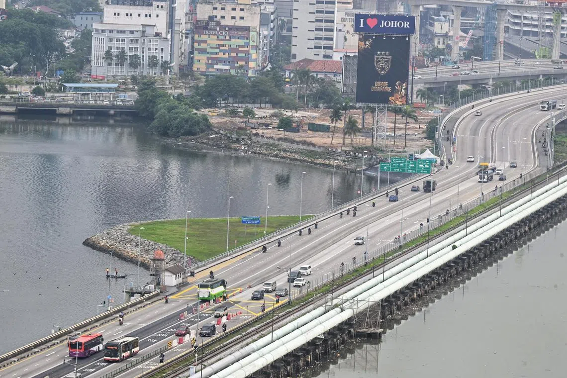 Traffic at the Woodlands Causeway on Oct 1. VEP for foreign-registered vehicles entering Johor will be implemented in phases.