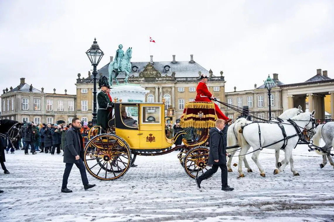 Denmark's Queen Margrethe is escorted by the Gardehusar Regiment's Horseskort in the gold carriage from Christian IX's Palace, Amalienborg to Christiansborg Palace in Copenhagen for the New Year's reception, in Denmark January 4, 2024.  Ritzau Scanpix/Emil Nicolai Helms via REUTERS