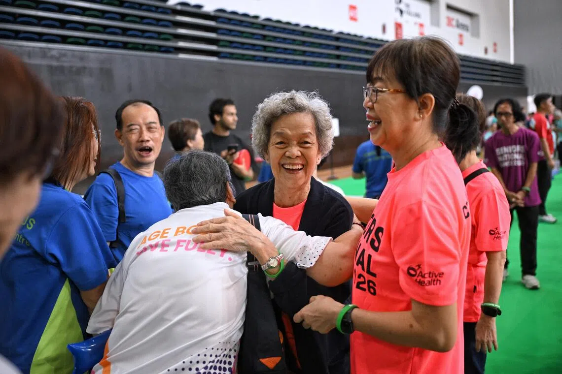 Madam Kwok Noi (centre), 90, and her daughter Madam Chan Yip Pheng (right) hug their teammates after takint part in the disc golf finals during the Seniors National Games Finals held at the OCBC Arena on August 4, 2026.