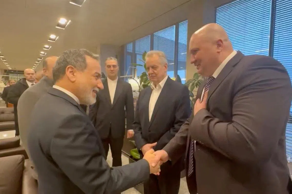 Iranian Foreign Minister Abbas Araghchi (left) with officials during his visit to St Petersburg, Russia, for talks on April 27.