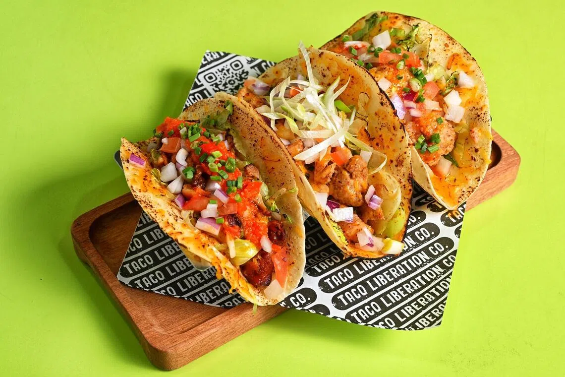 Peri peri chicken, BBQ chicken and glutinous pork meatball tacos from Taco Liberation Co.
