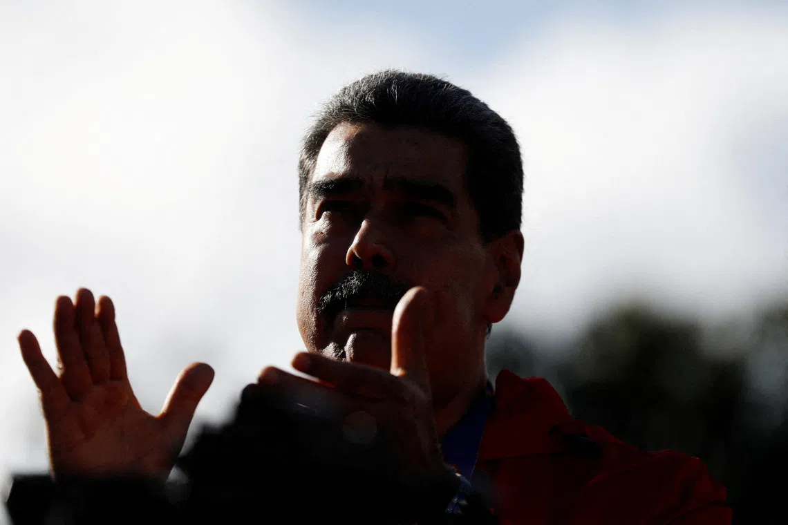 FILE PHOTO: Venezuela's President Nicolas Maduro participates in a demonstration to mark Indigenous Resistance Day, in Caracas, Venezuela, October 12, 2025. REUTERS/Leonardo Fernandez Viloria/File Photo