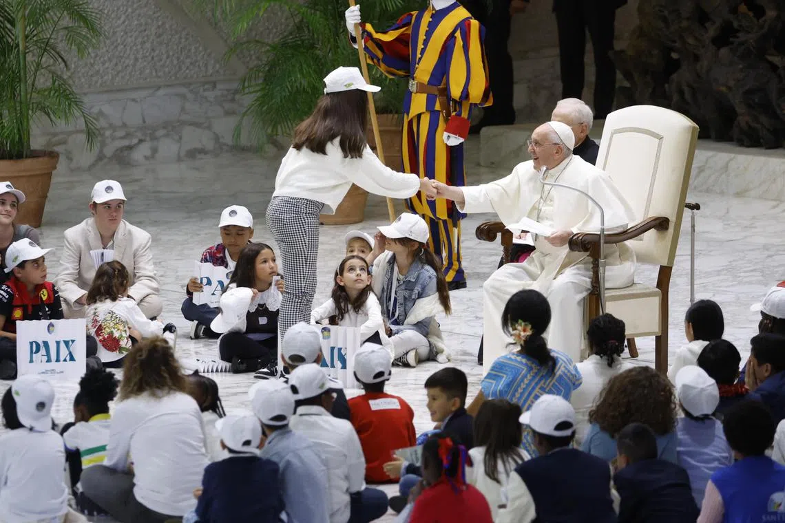 Pope Francis presided over a lively meeting with more than 7,000 children from around the world in the Vatican's audience hall.