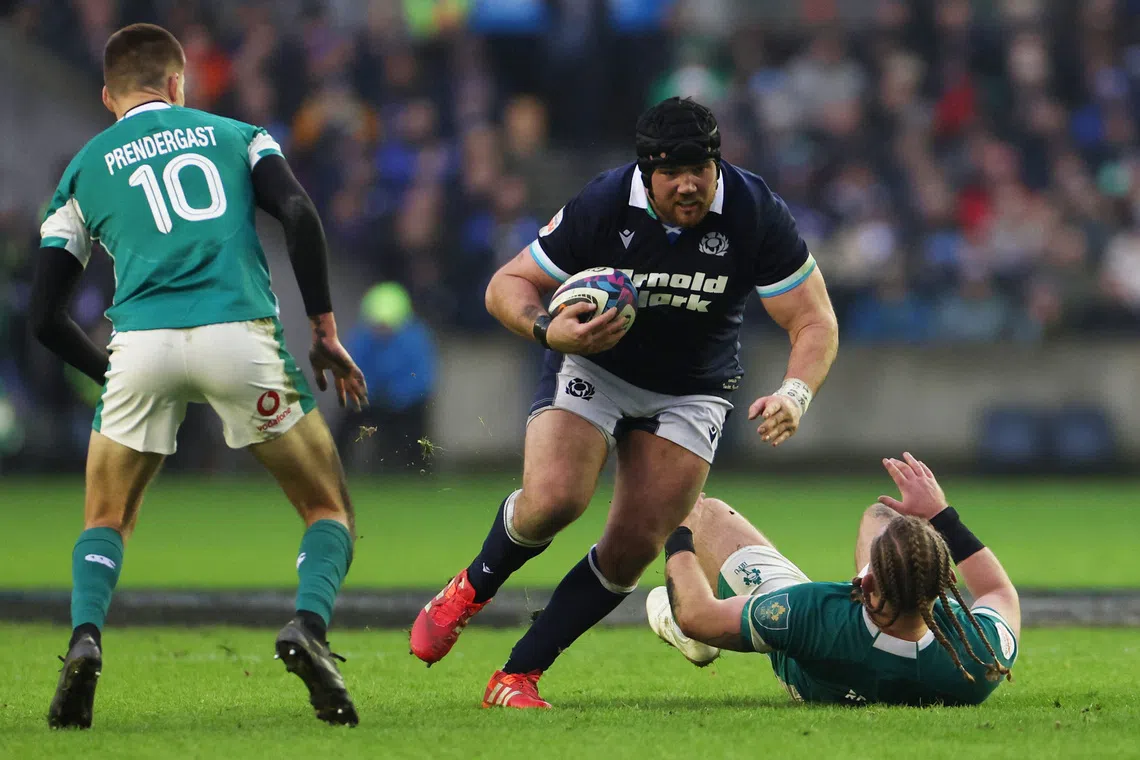 Rugby Union - Six Nations Championship - Scotland v Ireland - Murrayfield Stadium, Edinburgh, Scotland, Britain - February 9, 2025 Scotland's Zander Fagerson in action with Ireland's Finlay Bealham and Sam Prendergast REUTERS/Russell Cheyne