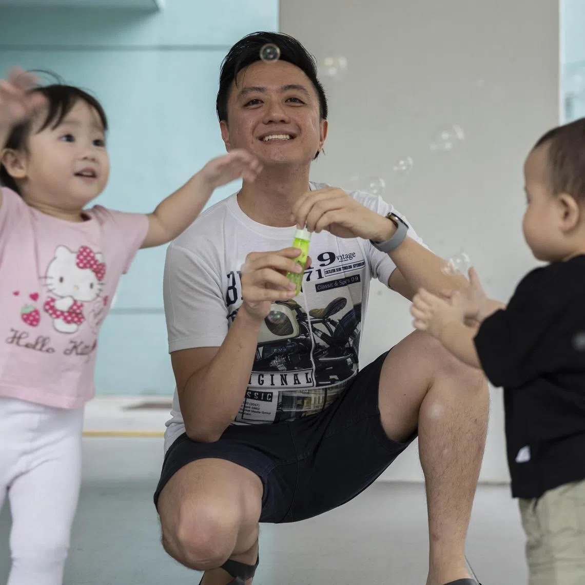 Mr Keith Low says he would rather miss a promotion at work than miss his children's first moments in the world. He took two weeks of paternity leave when his daughter Avril (left) was born in 2022 and four weeks for his son, Joaquin. ST PHOTO: BRIAN TEO