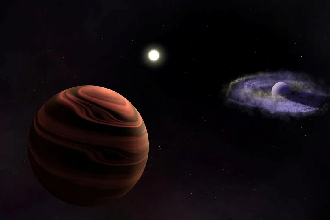 An artist's rendition of the sun-like star YSES-1 in the center, with the planet YSES-1 b and its dusty circumplanetary disk (right) and the planet YSES-1 c with silicate clouds in its atmosphere (left), is seen in this handout image obtained by Reuters on June 11, 2025. Ellis Bogat/Handout via REUTERS/Illustration    THIS IMAGE HAS BEEN SUPPLIED BY A THIRD PARTY. NO RESALES. NO ARCHIVES