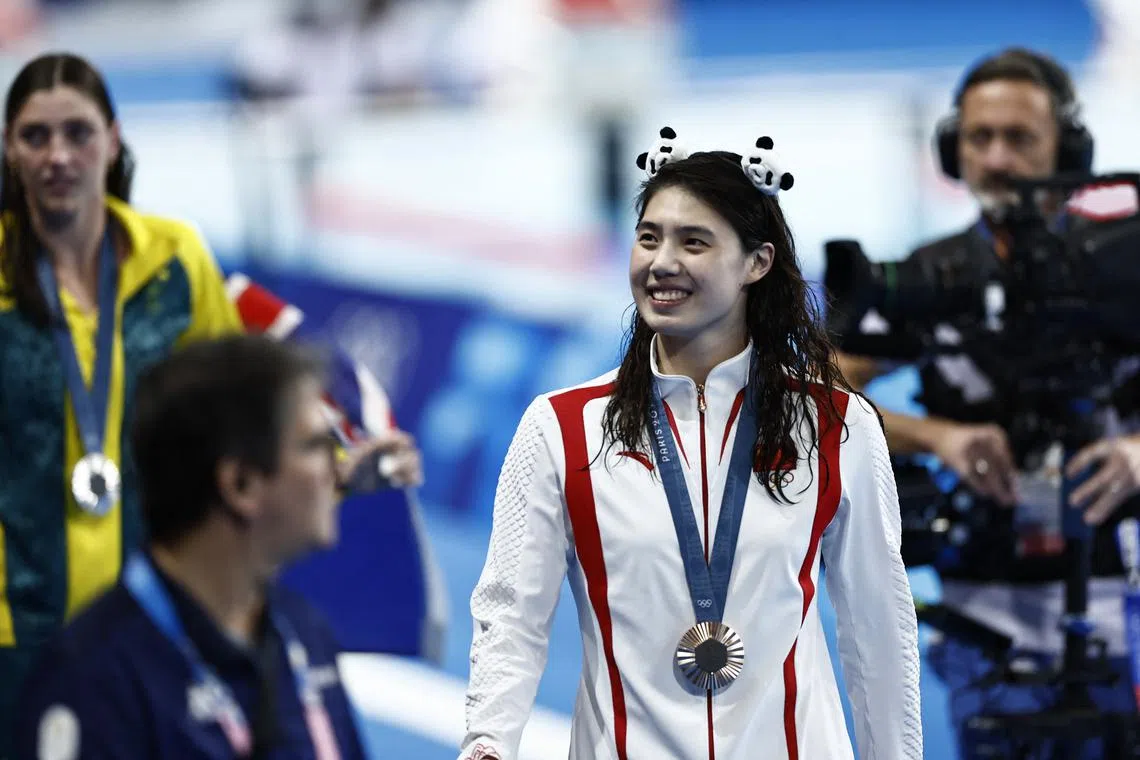 FILE PHOTO: Paris 2024 Olympics - Swimming - Women's 50m Freestyle Victory Ceremony - Paris La Defense Arena, Nanterre, France - August 04, 2024. Bronze medallist Yufei Zhang of China celebrates with a medal. REUTERS/Clodagh Kilcoyne/File Photo