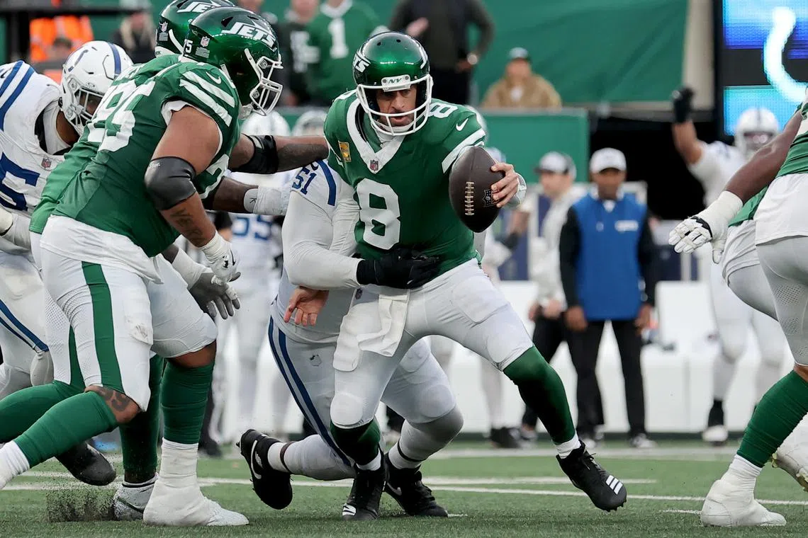 Nov 17, 2024; East Rutherford, New Jersey, USA; New York Jets quarterback Aaron Rodgers (8) is sacked by Indianapolis Colts defensive end Kwity Paye (51) as time runs out during the fourth quarter at MetLife Stadium. Mandatory Credit: Brad Penner-Imagn Images/ File Photo