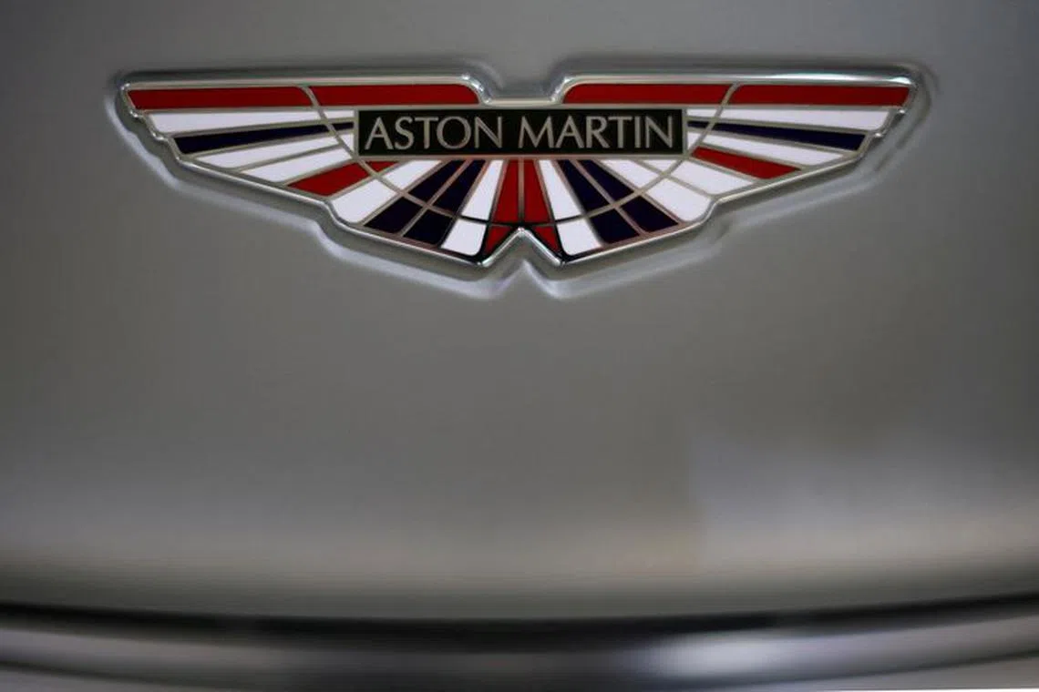 FILE PHOTO: The Aston Martin logo is seen on a V12 Vantage car at the company’s factory in Gaydon, Britain, March 16, 2022. Picture taken March 16, 2022. REUTERS/Phil Noble/File Photo