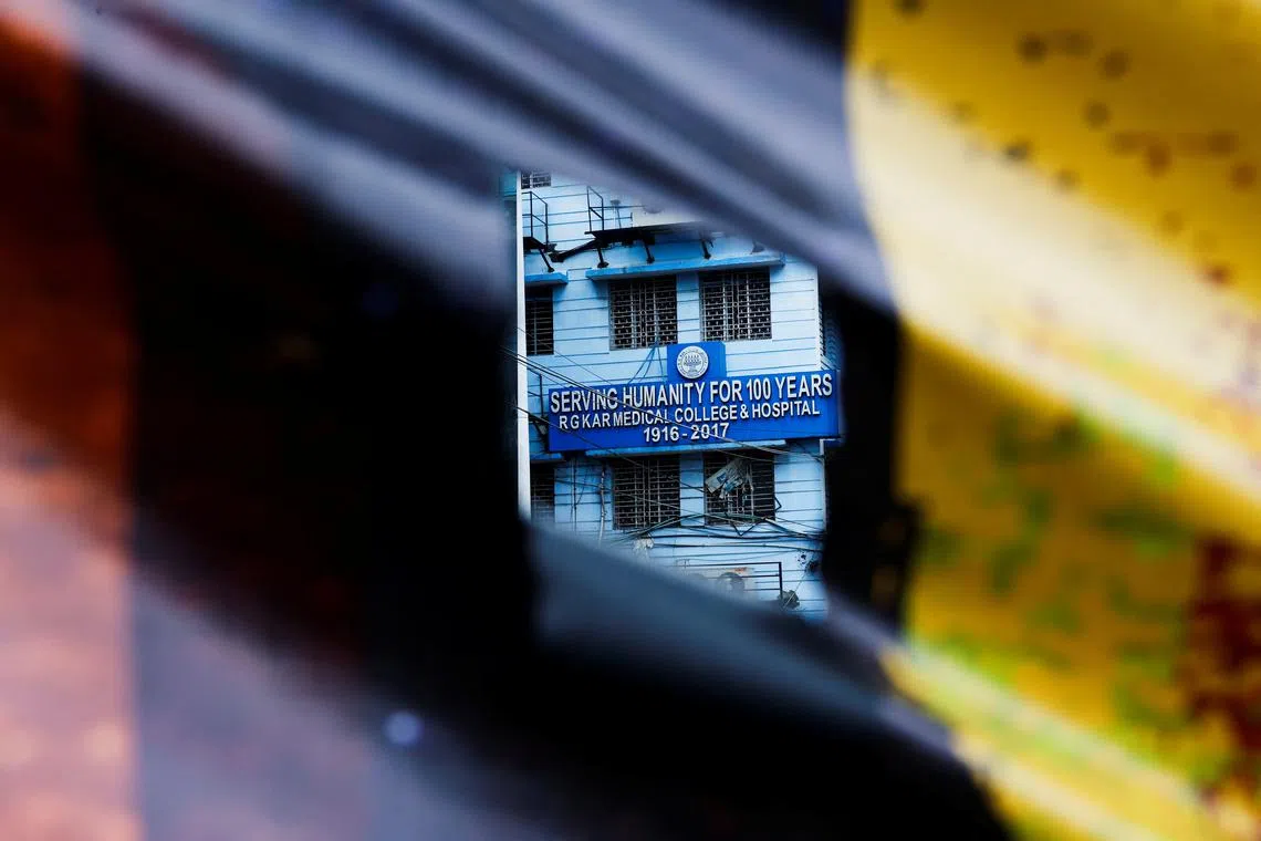 FILE PHOTO: A signboard of R G Kar Medical College and Hospital is seen through a poster hanging on a closed gate in Kolkata, India, August 19, 2024. REUTERS/Sahiba Chawdhary/File Photo