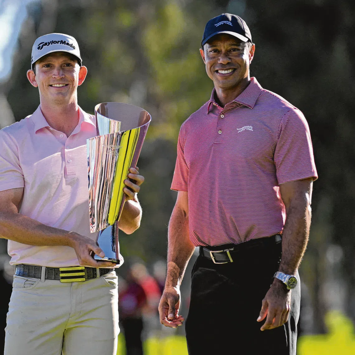 Tiger Woods (right), seen here with Jacob Bridgeman after the final round of The Genesis Invitational on Feb 22, is scheduled to appear in court on Sept 8.