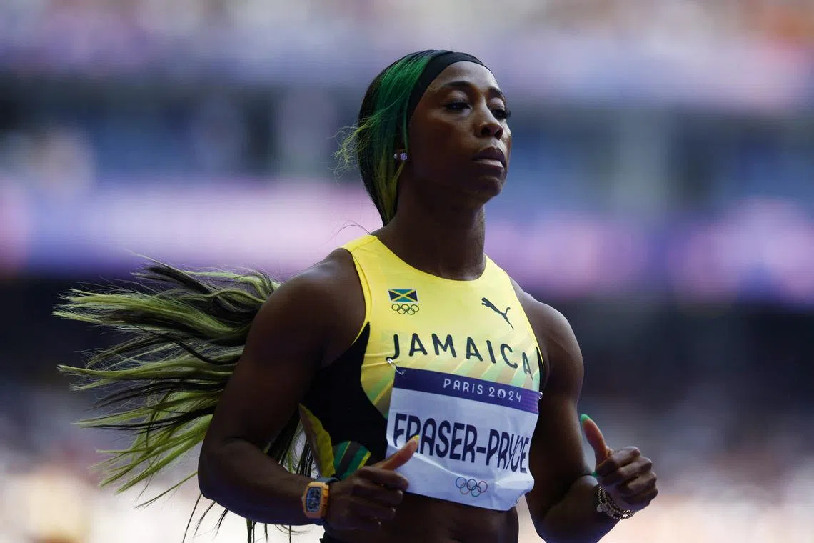FILE PHOTO: Paris 2024 Olympics - Athletics - Women's 100m Round 1 - Stade de France, Saint-Denis, France - August 02, 2024. Shelly-Ann Fraser-Pryce of Jamaica reacts after the heats. REUTERS/Sarah Meyssonnier/File Photo