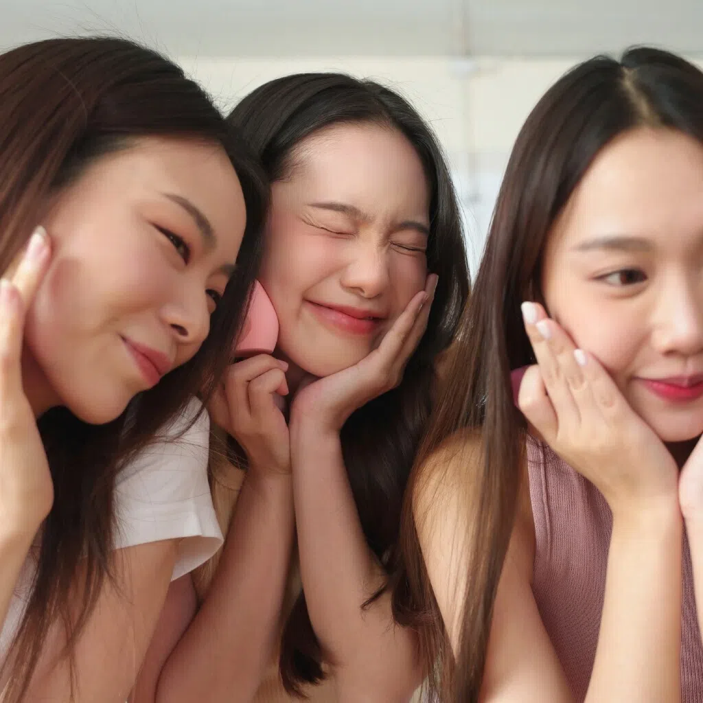 Three girls bonding over makeup and skincare