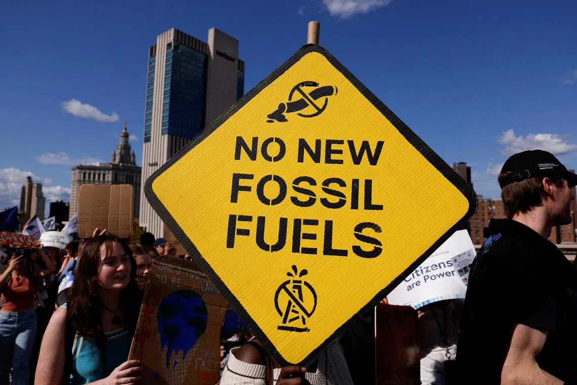 FILE PHOTO: Demonstrators march across the Brooklyn Bridge, rallying to call an end to the era of fossil fuel, New York City, U.S., September 20, 2024. REUTERS/Shannon Stapleton/File Photo