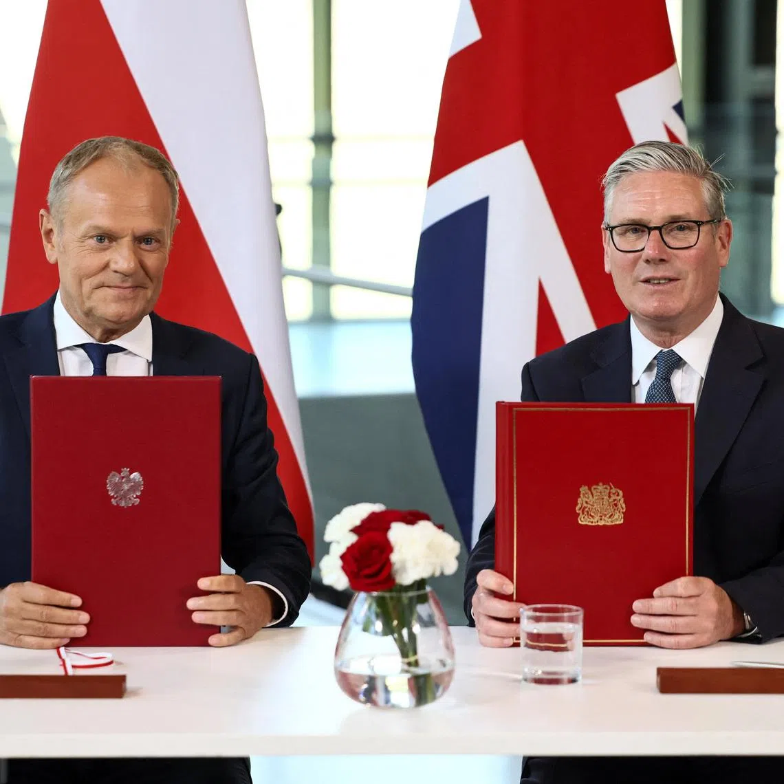 Britain's Prime Minister Keir Starmer and Poland's Prime Minister Donald Tusk attend a signing ceremony of a UK-Poland defence and security treaty at the Battle of Britain Bunker in Uxbridge, Britain, May 27, 2026. REUTERS/Jack Taylor/Pool