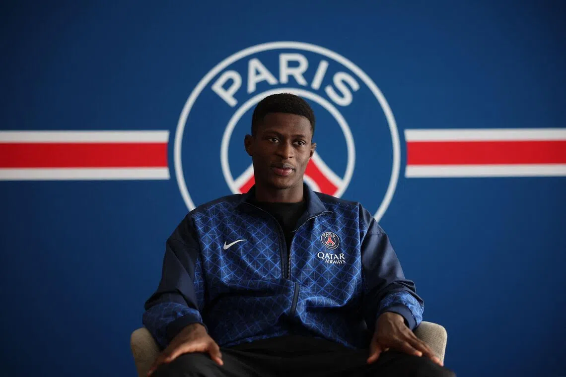 Paris Saint-Germain's Portuguese defender Nuno Mendes answers journalist's questions at the Campus Paris Saint-Germain in Poissy near Paris.
