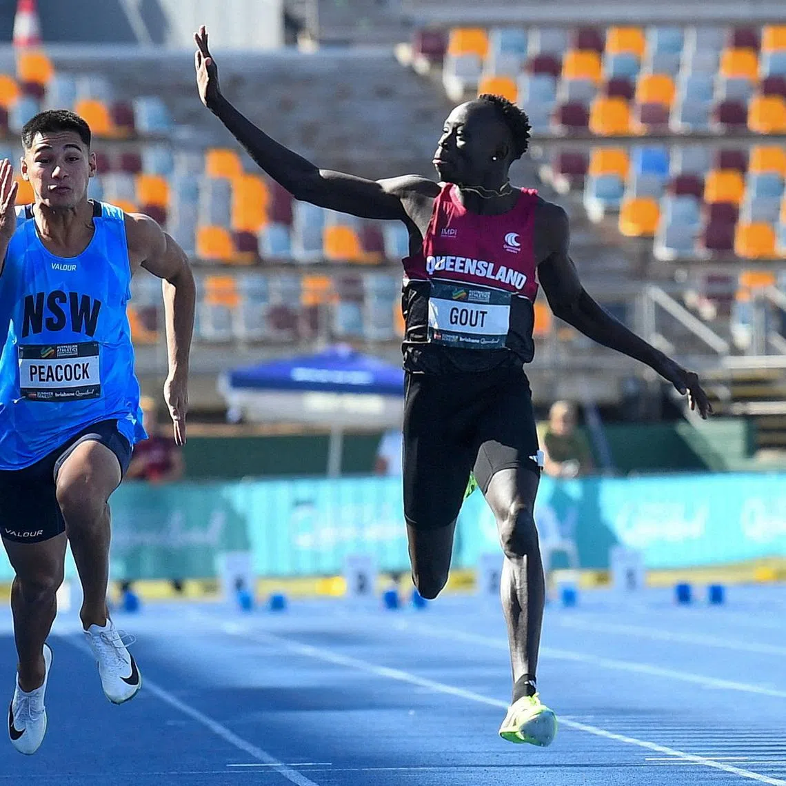 FILE PHOTO: Athletics - Australian Athletics Junior Championship - Brisbane, Australia - April 18, 2026 Gout Gout waves while winning the under 20s 100m final Jono Searle/AAP Image via REUTERS/ File Photo