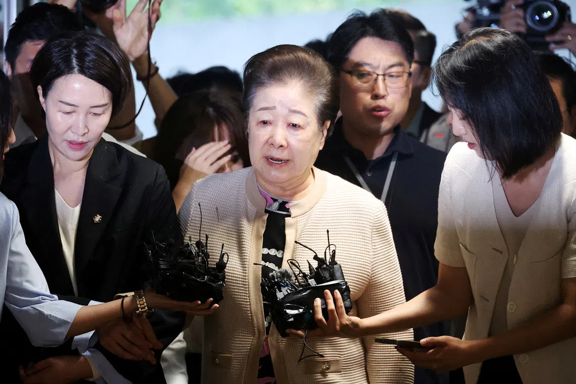Han Hak-ja, the leader of the Unification Church, arrives at the special prosecutors' office for questioning over allegations, which she has denied, that she instructed the church to bribe the wife of ousted President Yoon Suk Yeol and a politician close to Yoon, in Seoul, South Korea, September 17, 2025.   REUTERS/Kim Hong-Ji