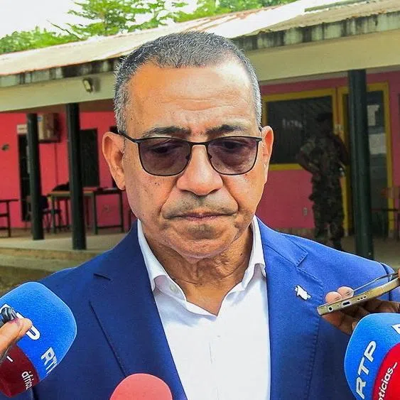 Incumbent President Carlos Vila Nova, seeking a new five-year term, talks to journalists after voting at a polling station during the presidential election in Sao Tome, Sao Tome and Principe, July 19, 2026. REUTERS/Guilherme Neto
