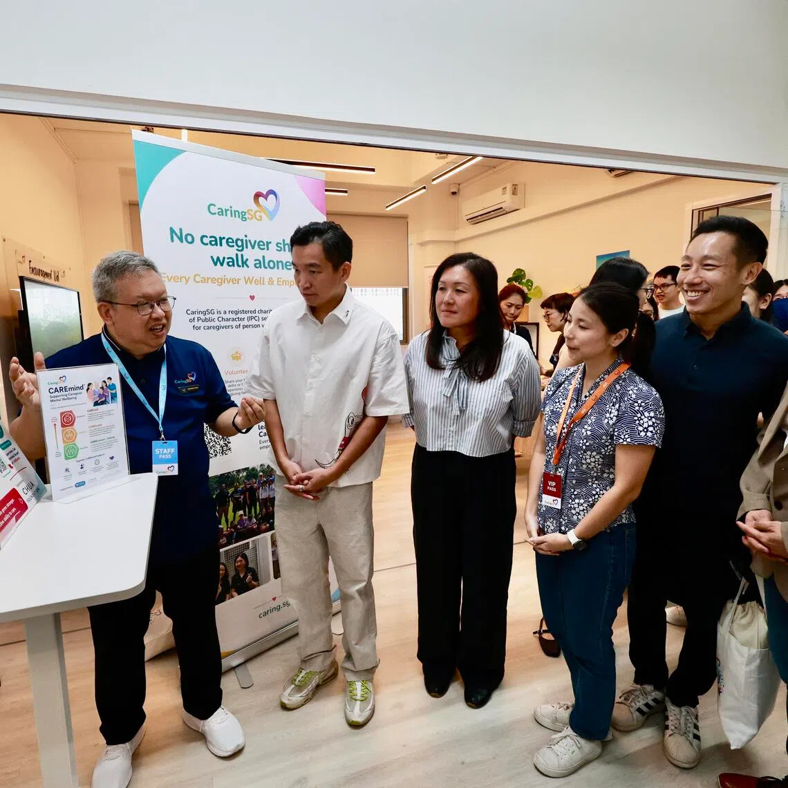 Senior Parliamentary Secretary for Social and Family Development Eric Chua (second from left) said CaringSG’s CAREmind programme will help caregivers get the support they need.