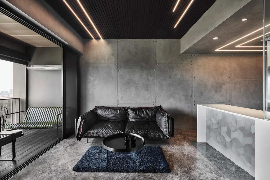 Dark furnishings and concrete textures characterise this Queenstown home.