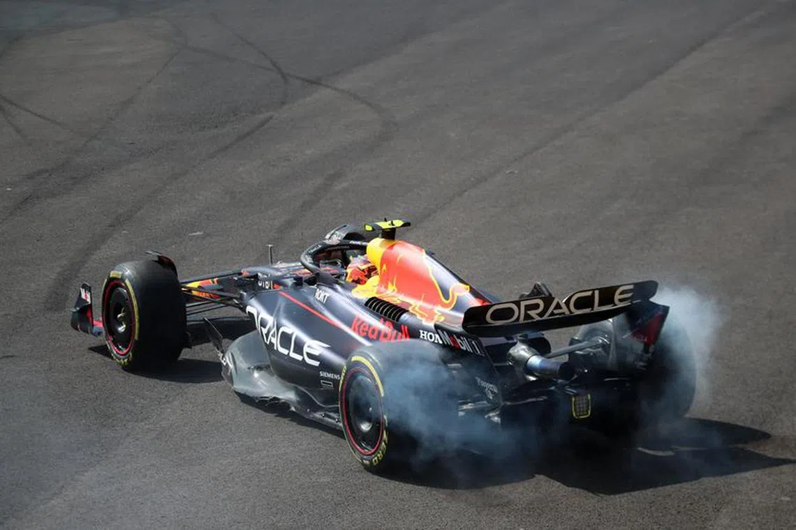 Formula One F1 - Mexico City Grand Prix - Autodromo Hermanos Rodriguez, Mexico City, Mexico - October 29, 2023 Red Bull's Sergio Perez crashes at the first corner of the race after contact with Ferrari's Charles Leclerc REUTERS/Henry Romero