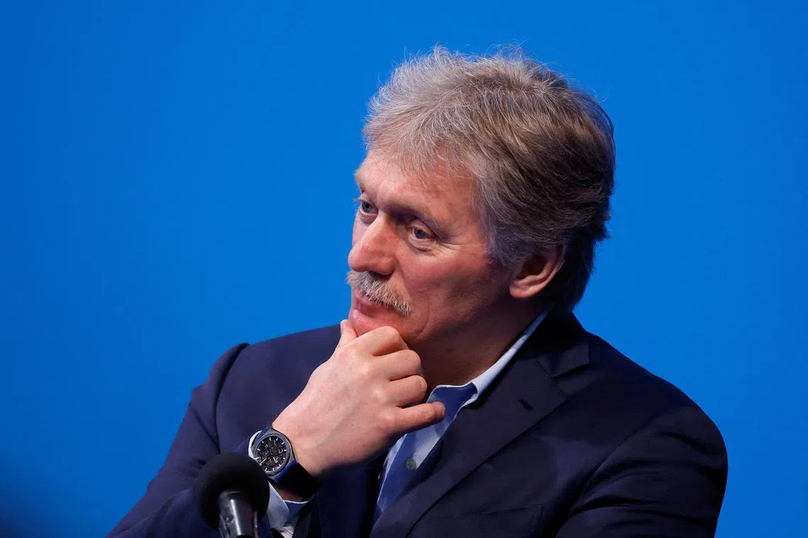 FILE PHOTO: Kremlin spokesman Dmitry Peskov listens as Russian presidential candidate and incumbent President Vladimir Putin (not pictured) speaks after polling stations closed, in Moscow, Russia, March 18, 2024. REUTERS/Maxim Shemetov/File Photo