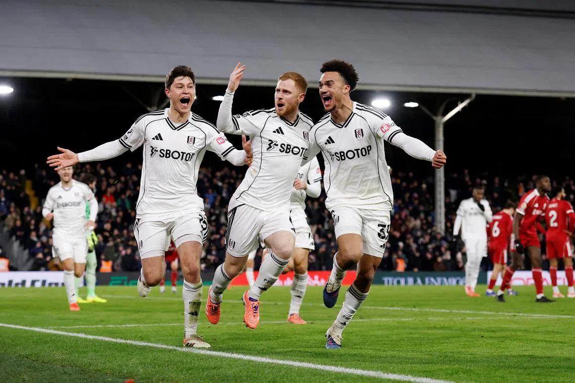 Soccer Football - Premier League - Fulham v Liverpool - Craven Cottage, London, Britain - January 4, 2026  Fulham's Harrison Reed celebrates scoring their second goal with Fulham's Jorge Cuenca and Fulham's Antonee Robinson Action Images via Reuters/Andrew Couldridge