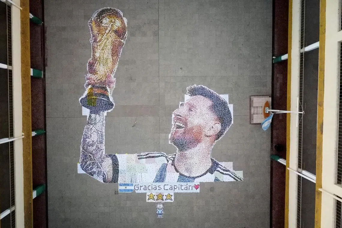 A mural made with plastic bottle caps created by high school students depicting Argentina's soccer superstar Lionel Messi, nine months after Argentina won the soccer World Cup Qatar 2022, on the outskirts of Buenos Aires, Argentina on Sept 19.