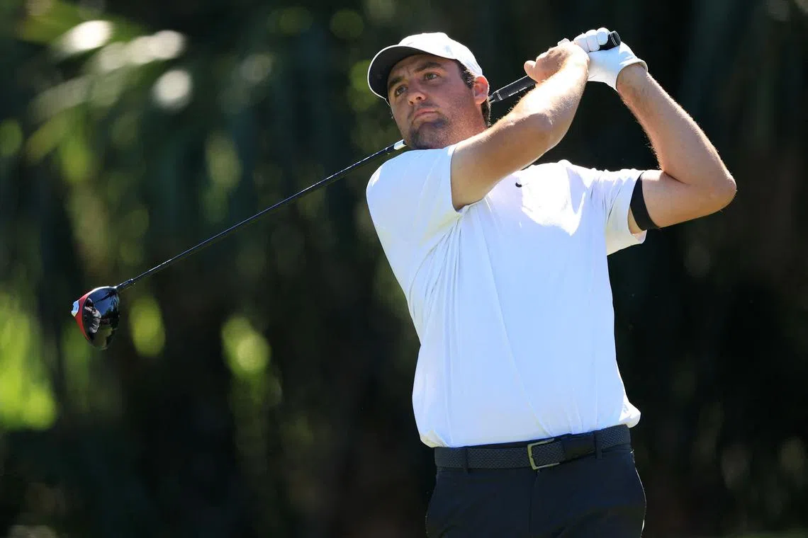 Scottie Scheffler of the United States plays his tee shot on the seventh hole during the third round of The Players Championship at TPC Sawgrass on Saturday. He shot a seven-under 65 to take a two-shot lead at the top of the leaderboard.