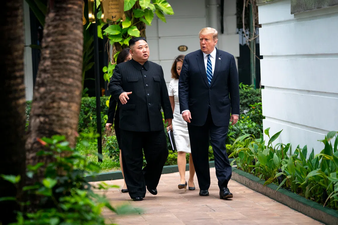 US President Donald Trump (right) walks with Kim Jong Un, the North Korean leader, as they head to a meeting in Hanoi, Vietnam, on Feb 28, 2019.