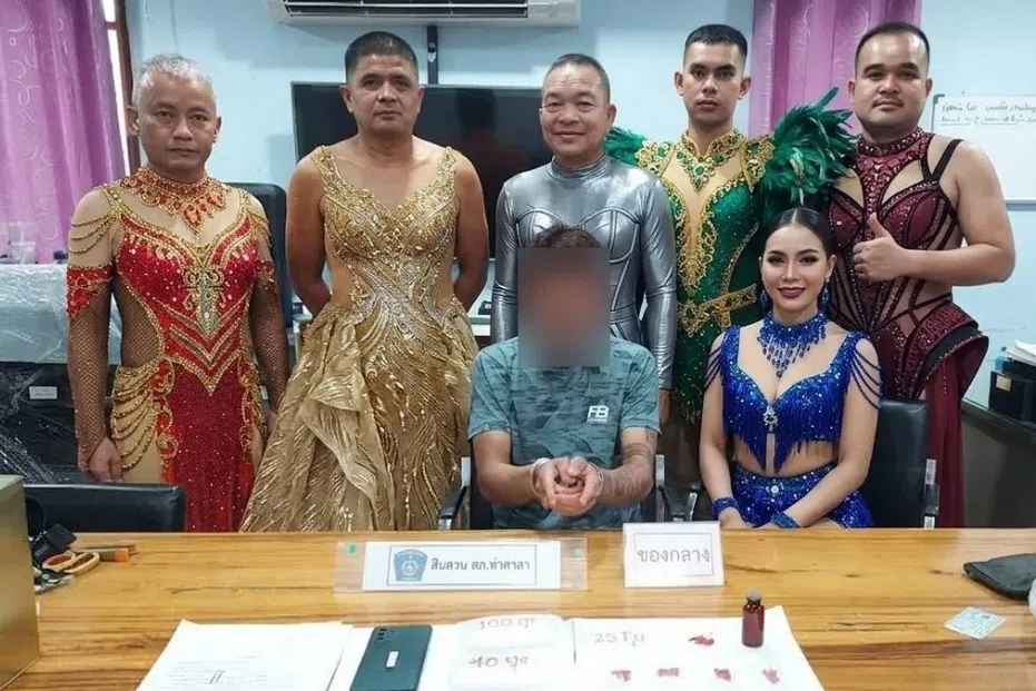 This photo of six officers shown in the dancer costumes while flanking a suspect became a viral sensation.