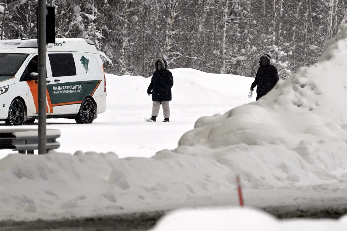 People walk at the re-opened Vaalimaa border check point between Finland and Russia.