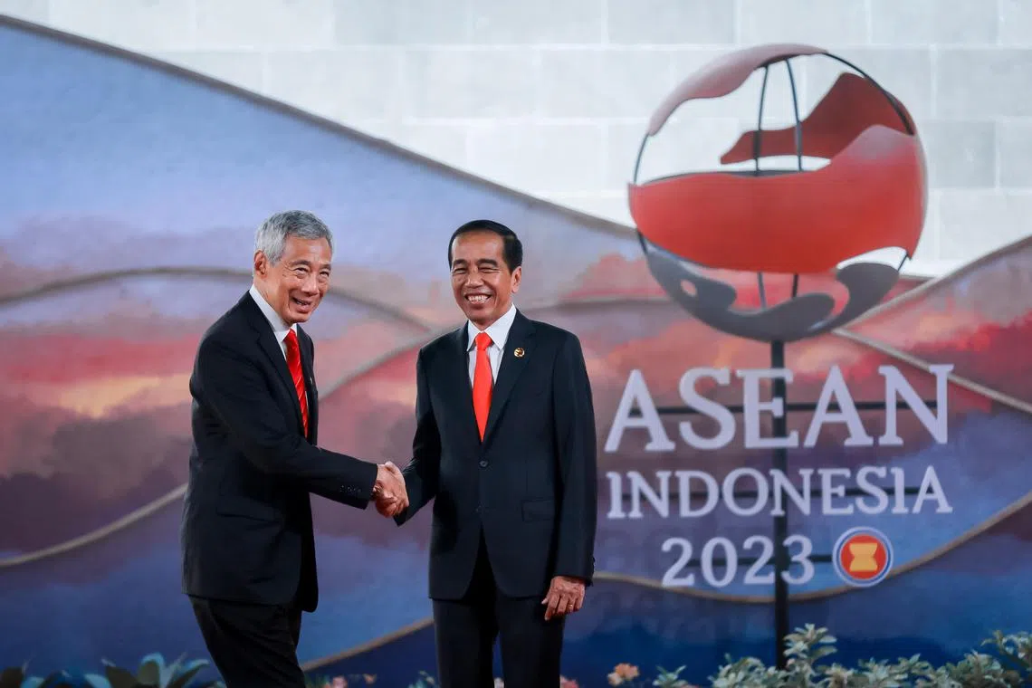 Singapore's prime minister Lee Hsien Loong being greeted by Indonesia's president Joko Widodo as he arrives to the 42nd Association of Southeast Asian Nations (ASEAN) Summit held at the Meruorah Convention Center in Labuan Bajo, Indonesia, May 10, 2023.