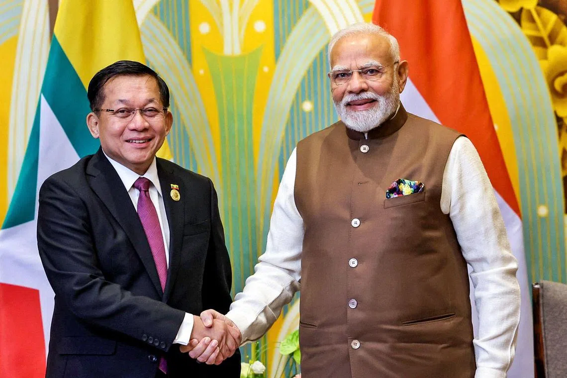 Myanmar's junta chief Min Aung Hlaing (left) meeting India’s Prime Minister Narendra Modi in Tianjin, China, on Aug 31.
