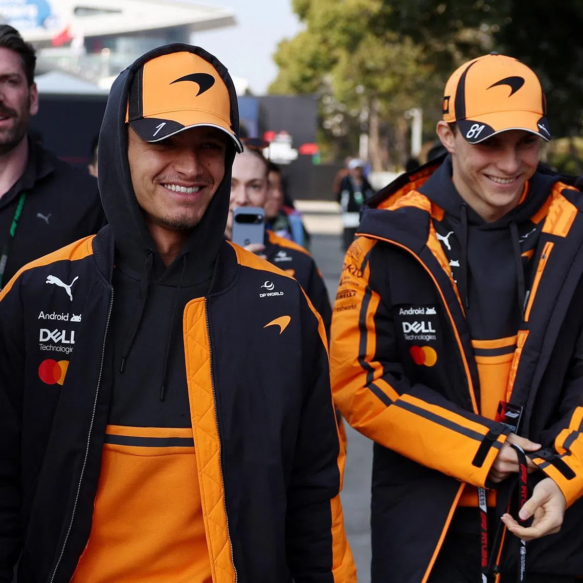 Formula One F1 - Chinese Grand Prix - Shanghai International Circuit, Shanghai, China - March 14, 2026 McLaren's Lando Norris and McLaren's Oscar Piastri arrive ahead of sprint REUTERS/Jakub Porzycki