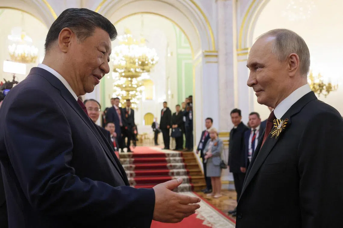 Russian President Vladimir Putin shakes hands with Chinese President Xi Jinping during a reception, held on Victory Day marking the 80th anniversary of the victory over Nazi Germany in World War Two, at the Kremlin in Moscow, Russia, May 9, 2025. Sputnik/Mikhail Metzel/Pool via REUTERS/File Photo