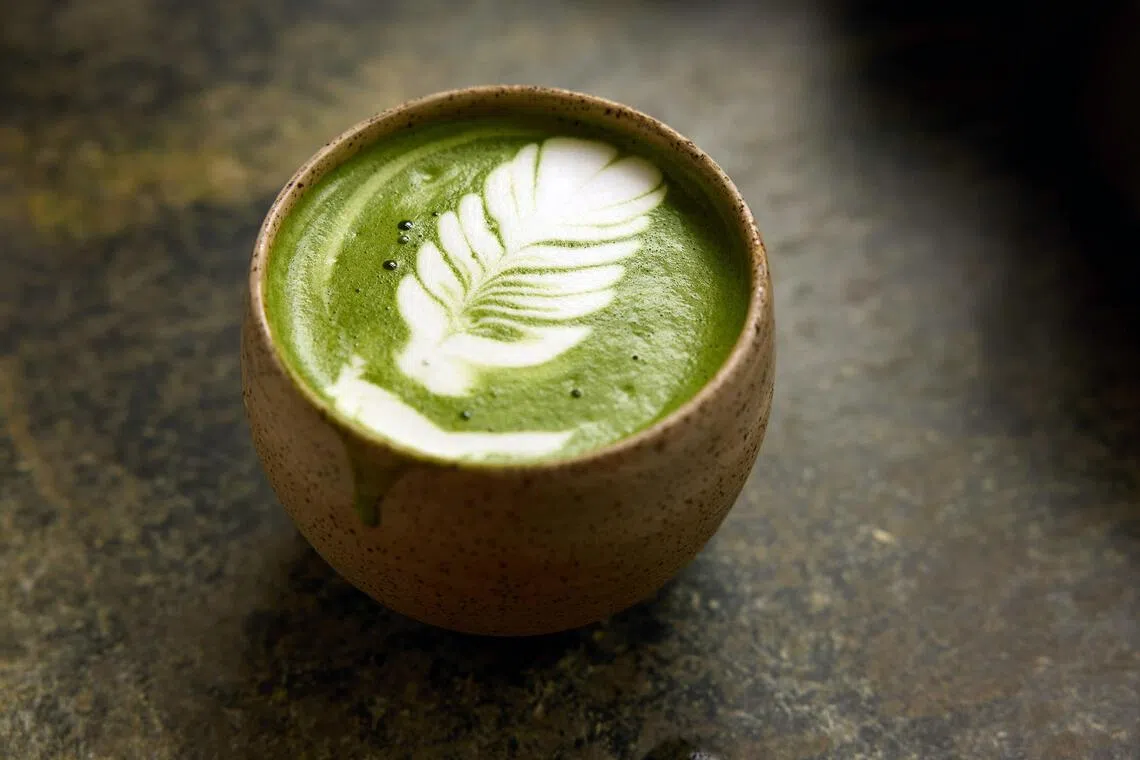 HEADLINE: Maybe Too Much Matcha
CAPTION: A matcha latte at Kettl, which sells Japanese tea at its store, in Brooklyn, Oct. 8, 2025. Once consumed mainly in small, formal tea ceremonies, matcha is now mixed into fruity lattes and preyed on by counterfeiters. 
CREDIT: (Colin Clark/The New York Times)