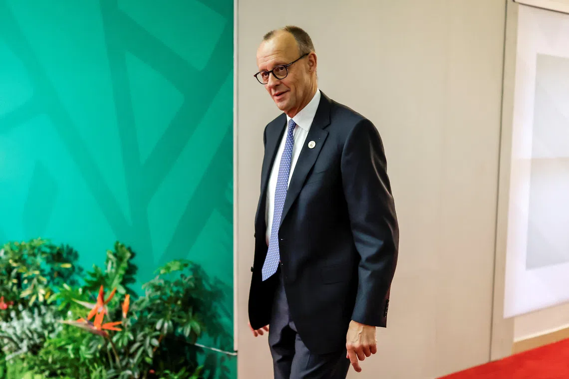 German Chancellor Friedrich Merz arrives for the second day of the G20 Leaders' Summit at the Nasrec Expo Centre in Johannesburg on November 23, 2025.     MARCO LONGARI/Pool via REUTERS