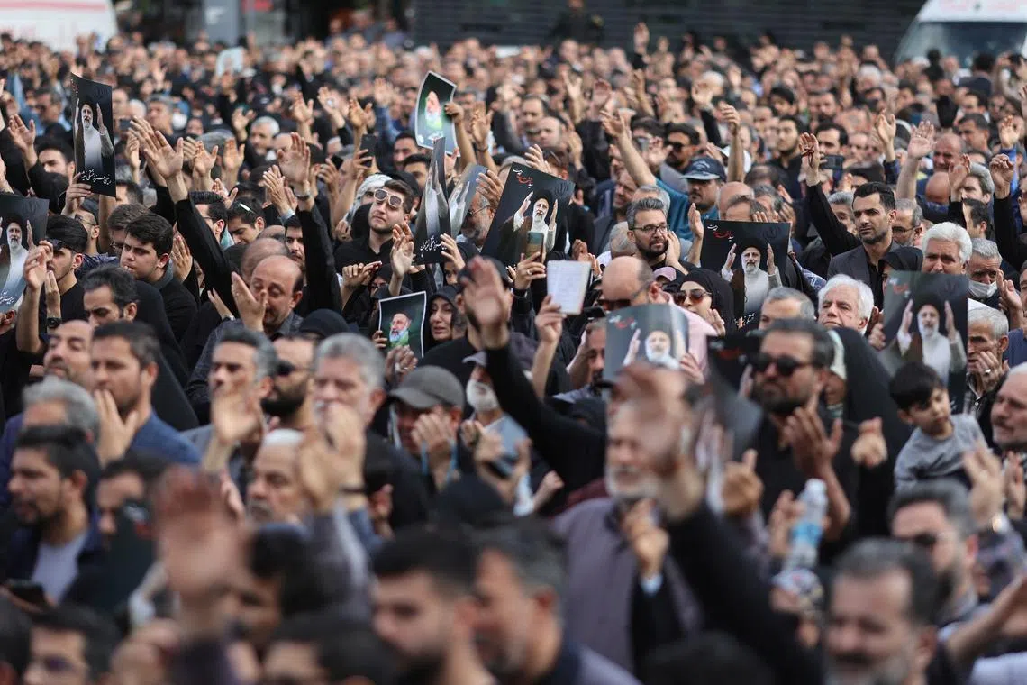 People gather to mourn for the death of the late Iran's President Ebrahim Raisi, in Tehran, Iran May 20, 2024. Majid Asgaripour/WANA (West Asia News Agency) via REUTERS