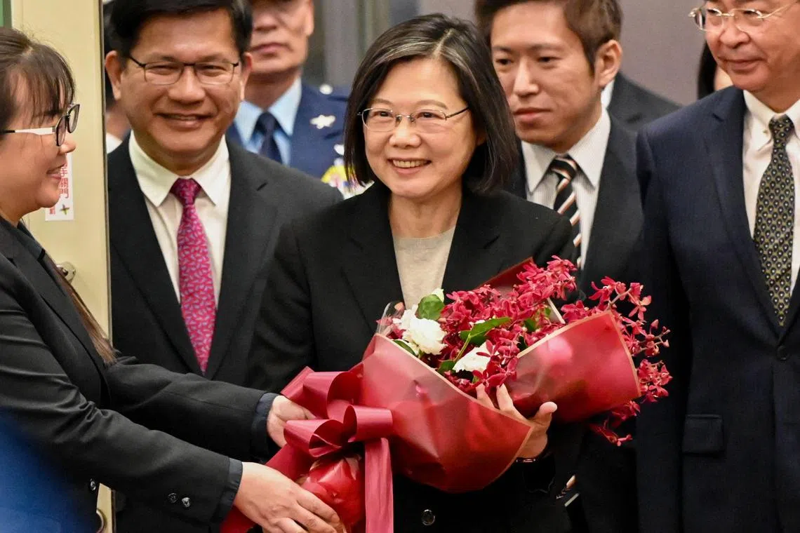 Taiwan's President Tsai Ing-wen receives flowers upon her arrival at the Taoyuan International Airport on April 7, 2023. (Photo by Sam Yeh / AFP)